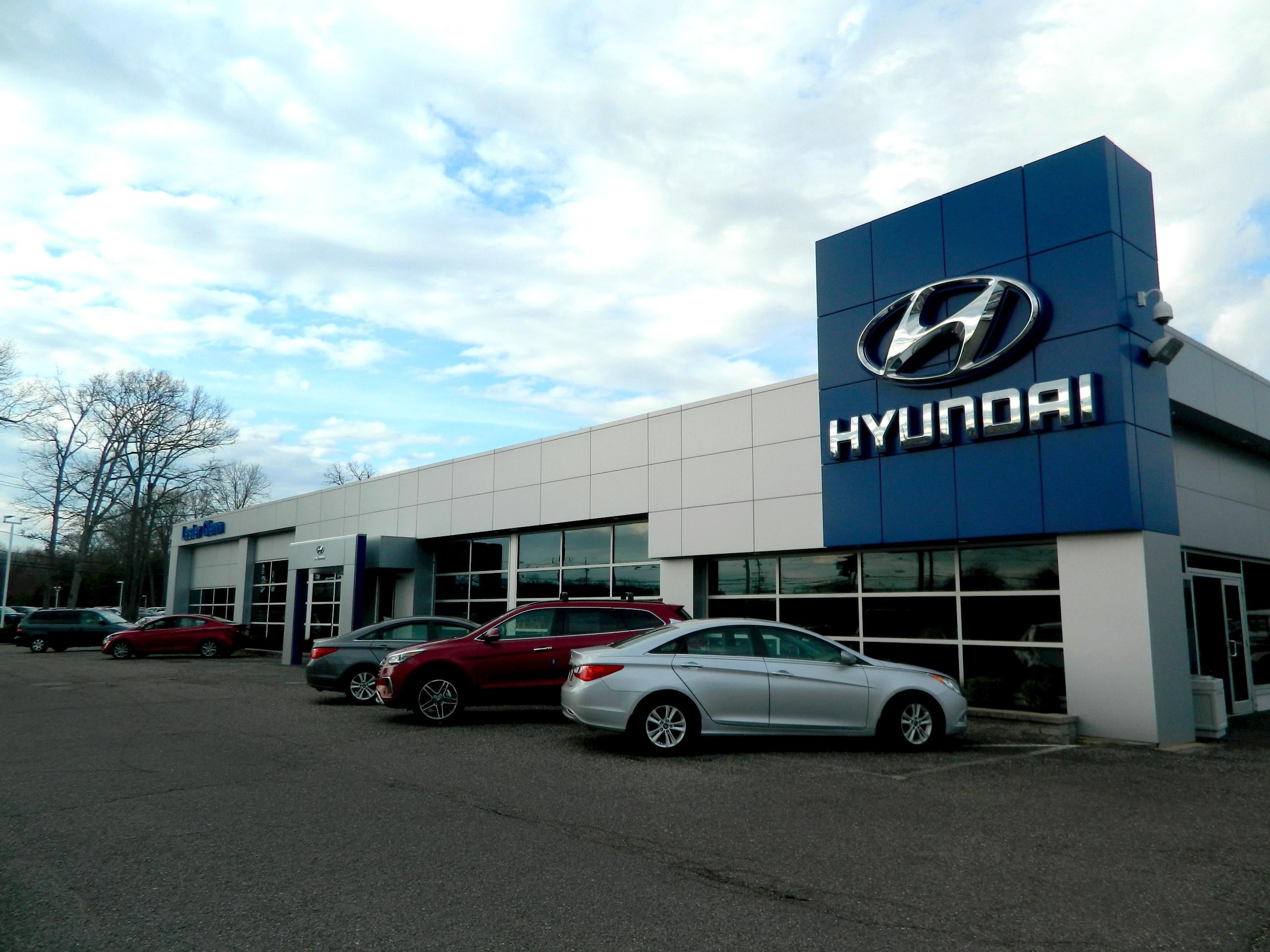 Hyundai showroom exterior with parked cars