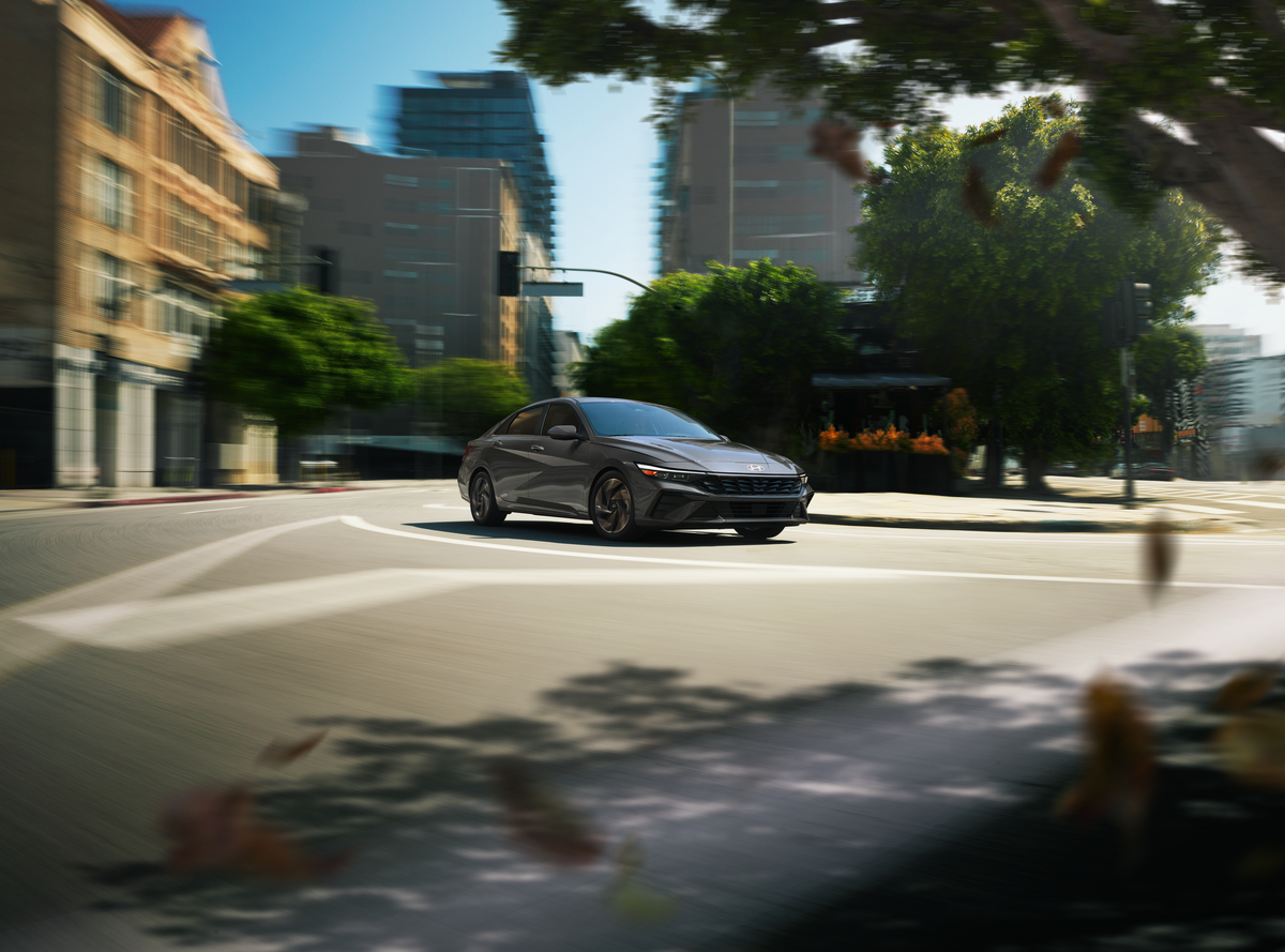 2026 Hyundai Elantra Hybrid showcasing its powertrain and performance features on the road